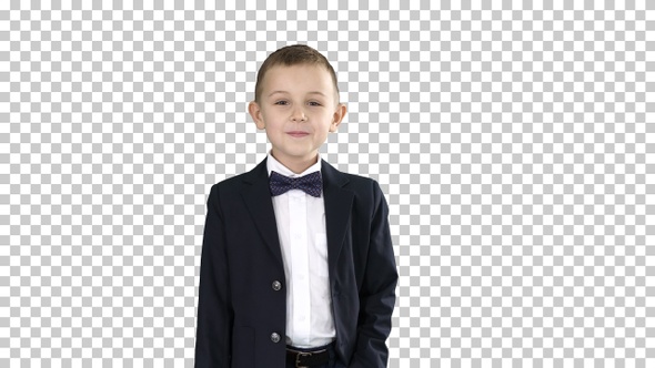 Boy in formal costume walking with a hand in pocket, Alpha Channel alt