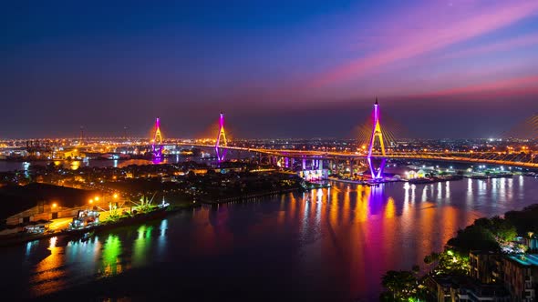 day to night time lapse of Bhumibol suspension bridge cross over Chao Phraya River in Bangkok alt