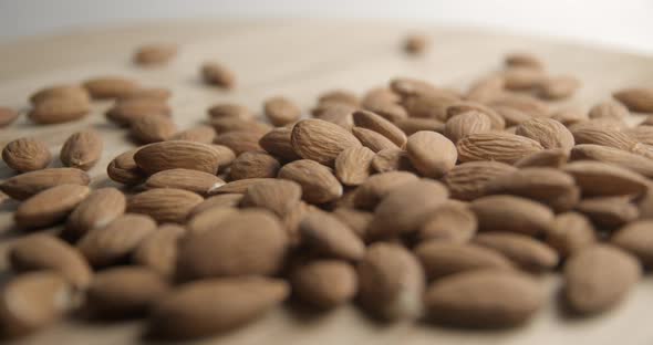Almonds falling and rotating macro studio