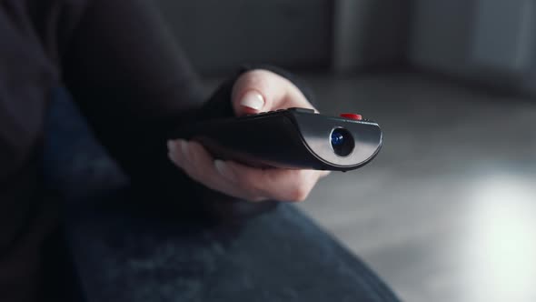 Cinematic Woman with Manicure Switches Channels Watch Tv at Home Closeup Woman Relaxes in Front of alt