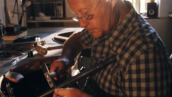 Goldsmith preparing work tool alt