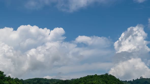 4K Amazing timelapse video of clouds. Blue sky white clouds. Fluffy white clouds. Cumulus cloud alt