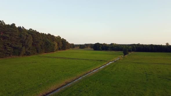 1 million $ aerial flight fly forwards drone shot close to ground up to the skyin nature reserve Mü alt