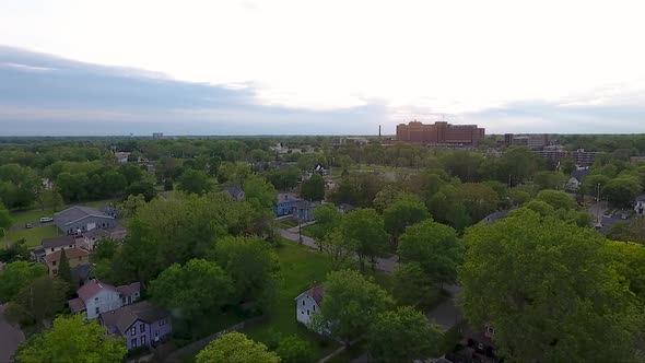 The houses of Flint, Michigan are captured from above bay drone at dusk. alt