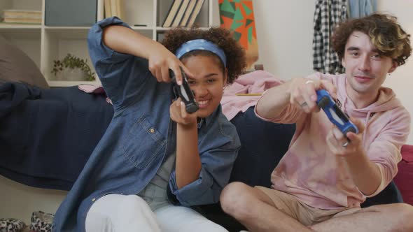 Girl and Guy Playing on Console alt