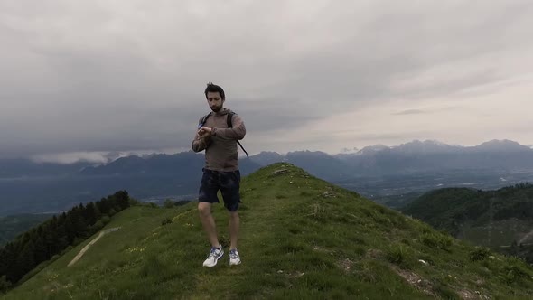 Tourist runner exploring mountains and jogging outdoors