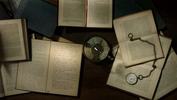 View over books and kerosene lamp