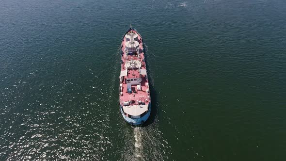 Aerial Shot of a Big Barge Moving in the Middle of the Dnipro on a Sunny Day  