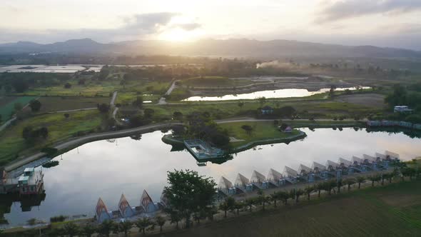 Aerial view of hotel resort with green Mountain hill. Nature landscape