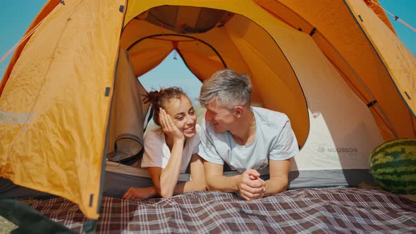 Happy Authentic Moments Couple in Camping Travel Vacation Lying in Tent Together alt