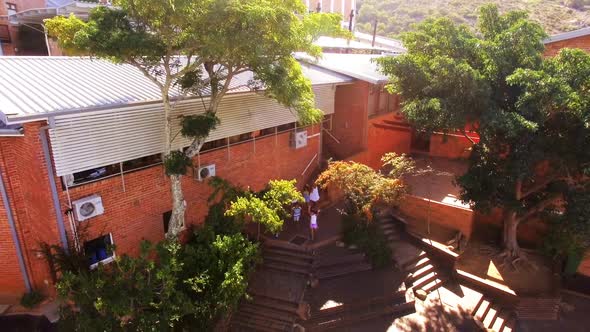 Group of kids getting down from staircase alt