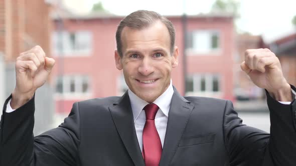 Businessman Celebrating Successful Results alt