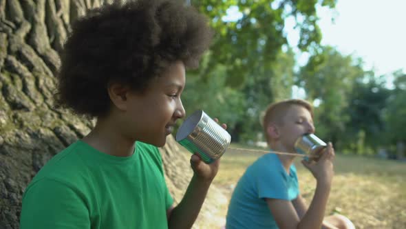 Happy Multiethnic Friends Talking Through Cans, Happy Childhood Without Gadgets