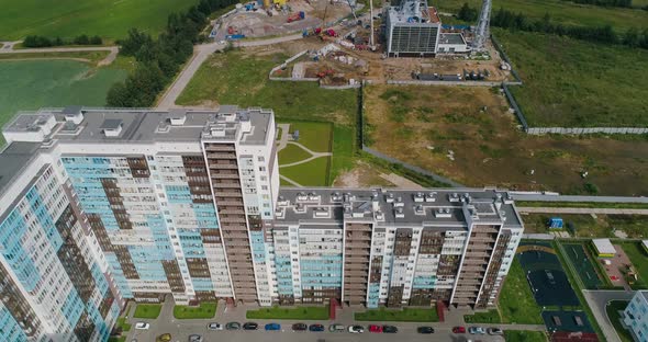 Residential Area with Construction Site of Gas Power Plant on the Back alt