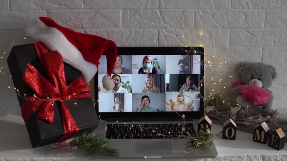 Video Call Celebrating Christmas By Laptop Online During Coronavirus Outbreak alt