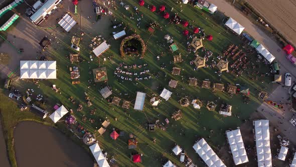 A dynamic top down descending aerial footage towards the Feria Masticar food festival in Buenos Aire alt