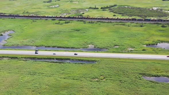 Aerial view, railway and road in rural landscape