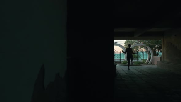 Woman Are Jumping Rope in Archway alt