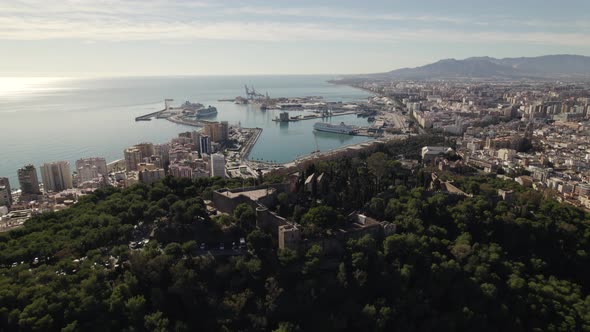 Aerial pan of Mount Gibralfaro castle ruins, panoramic port and city view