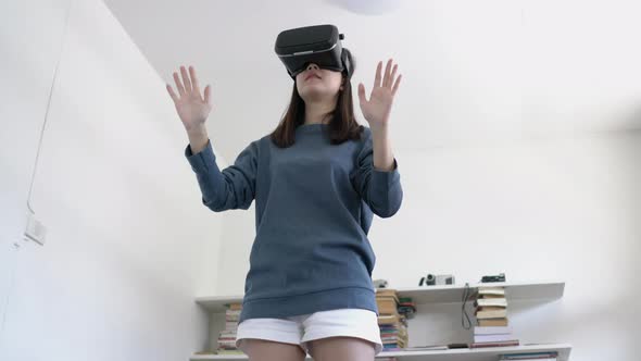 Girl playing virtual video game alt