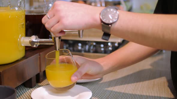 Orange Juice Is Poured Into A Glass
