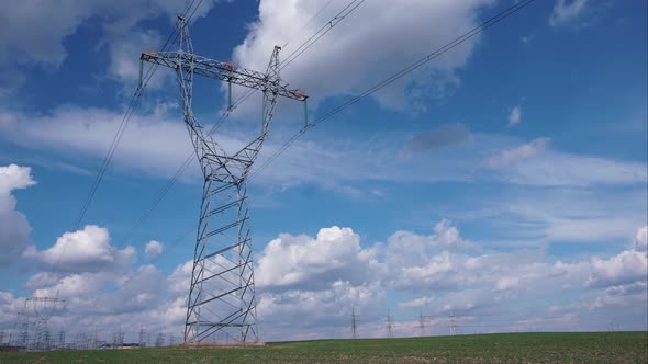 Timelapse High voltage electricity tower and power lines alt