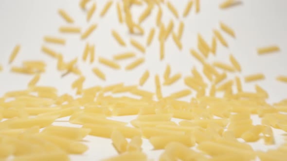 Stream Of Penne Rigate Pasta Moving To A Camera
