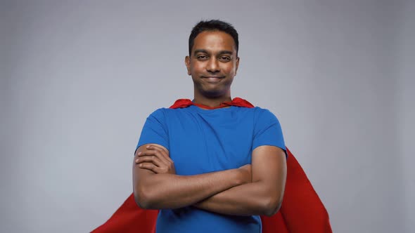Indian Man in Superhero Cape Showing Thumbs Up alt