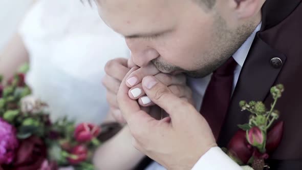 Wedding Couple is Holding Hands