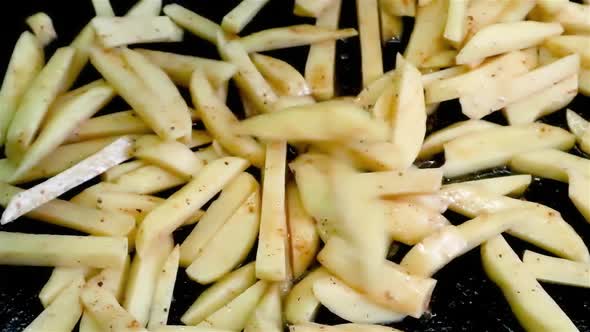 Drop down long cut raw fries potatoes slices close