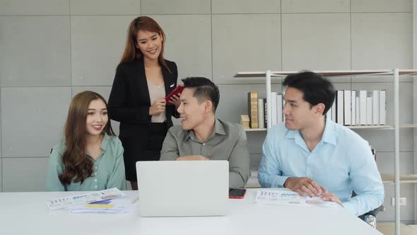 Business people meeting and planning with laptop alt