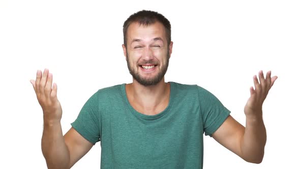 in Slow Motion Headshot Portrait of Bearded Hilarious Man 30s Wearing Shirt Laughing Chuckling alt