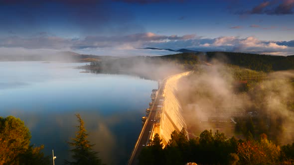Morning Fog over Dam in Aguilar de Campoo, Spain. alt