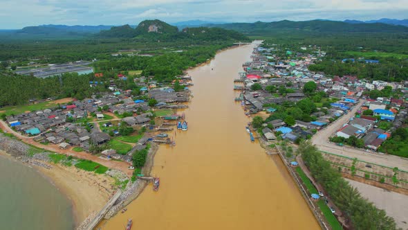 An aerial view over the river, fishing villages and fishing boats alt