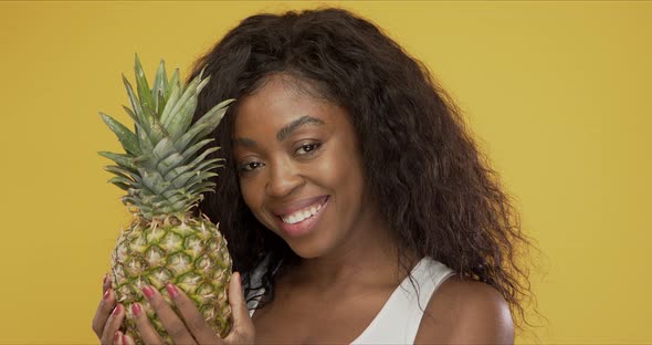 Positive African American Woman with Pineapple