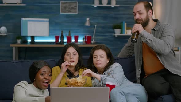 Multiethnic Friends Spending Time Together Looking at Entertainment Movie alt