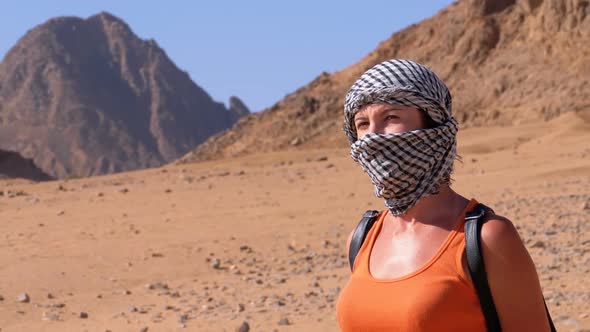 Girl in the Keffiyeh in Desert of Egypt alt