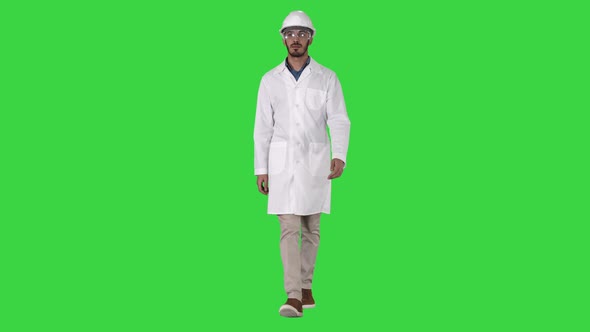 Science engineer walking in safety helmet and glasses on alt