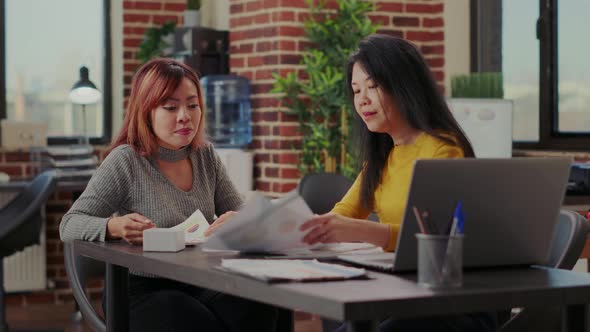 Team of Asian Women Brainstorming Strategy Ideas in Office alt