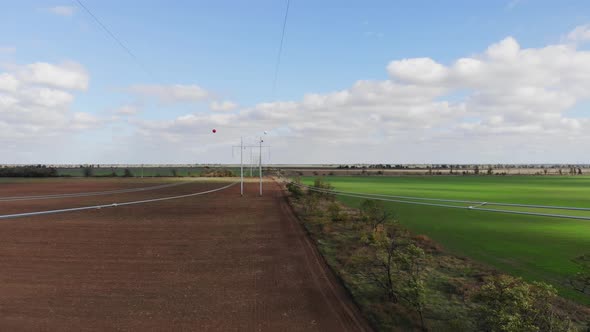 Highvoltage Power Line and Special Marker Balls Installed on Wires in Rural Areas