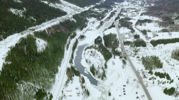 Snowy Landscape By The Mountains In Haugastol Norway On A Beautiful Winter Day- aerial shot alt