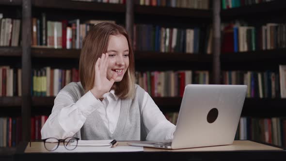 Schoolgirl Learning Online with Teacher Tutor Waving Hand Using Video Conference Call By Webcam on alt