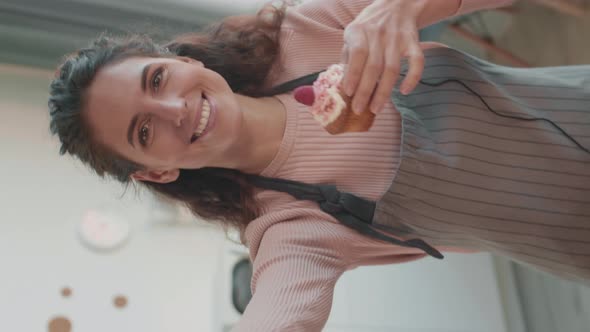 Caucasian Woman Posing with Cupcakes alt