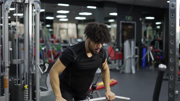 Young Man Exercising on Lateral Pull at Gym for the Back Mucles Slow Motion alt
