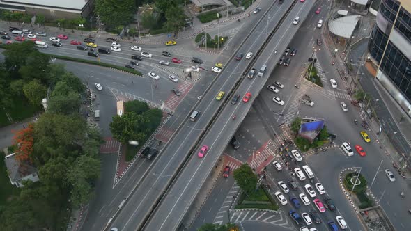 Traffic on Crossroad on Street. From Above Modern Cars and Motorcycles Driving on Intersection on alt