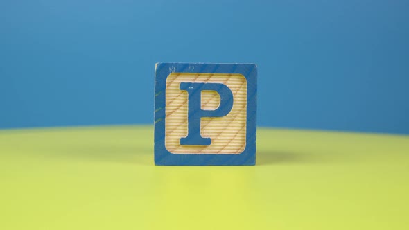 Close up shot letter "P" alphabet wooden block alt