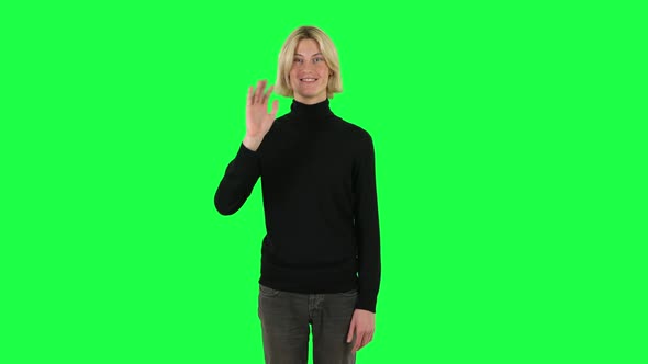 Blonde Guy Waving Hand and Showing Gesture Come Here. Green Screen alt
