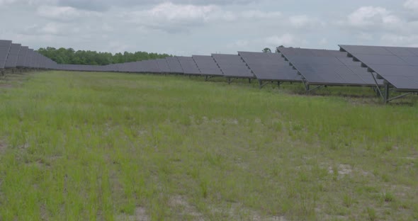shots of solar panels on a solar farm alt
