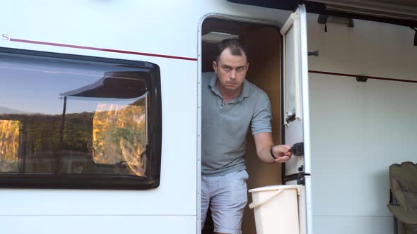 Suspicious Travel Man Walks Out of Camper Van to Uninvited Guests alt