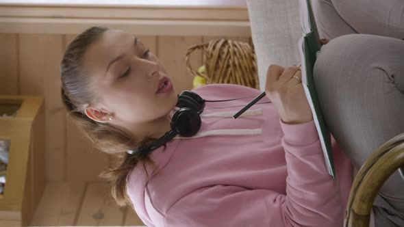 Vertical Shot Young Caucasian Student Girl in Pink Hoodie Studying at Home During Quarantine